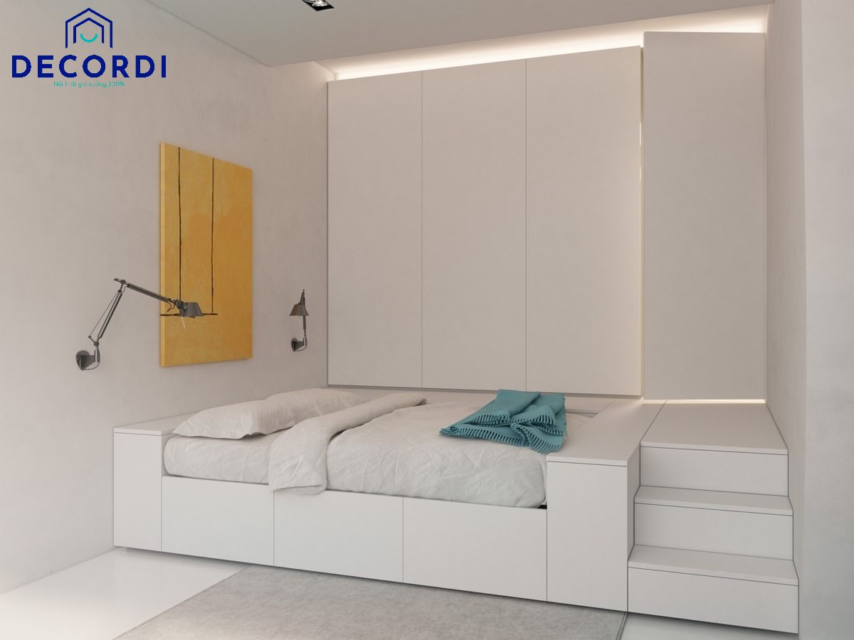 Căn phòng nhỏ thông minh với gam màu trắng được thiết kế giường bục có hộc kéo và cầu thang, tủ treo âm tường