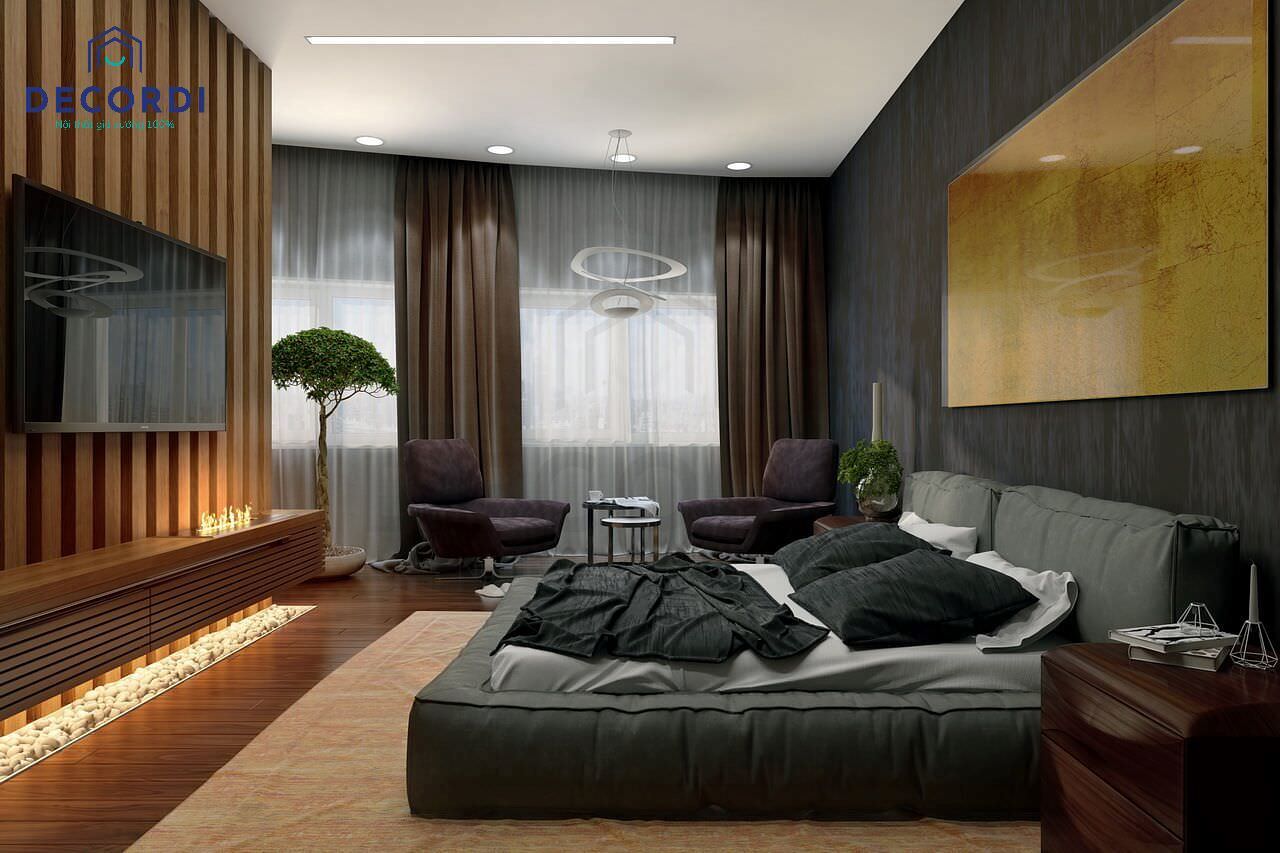 Không gian phòng ngủ rộng rãi nhưng vô cùng ấm cúng với tông màu gỗ từ bộ nội thất gồm kệ tivi kết hợp, vách lam gỗ, lót sàn và tab đầu giường