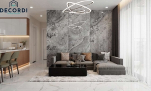 Thiết kế nội thất phòng khách chung cư sử dụng gam màu xám hiện đại, sang trọng với điểm nhấn là vách đá sau sofa